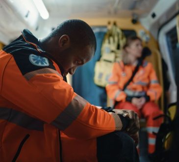 Paramedics in back of ambulance.