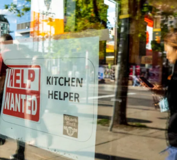 Help wanted sign in store window