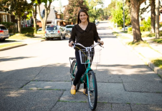 Woman on bike on residential street