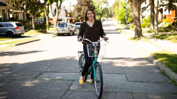 Woman on bike on residential street