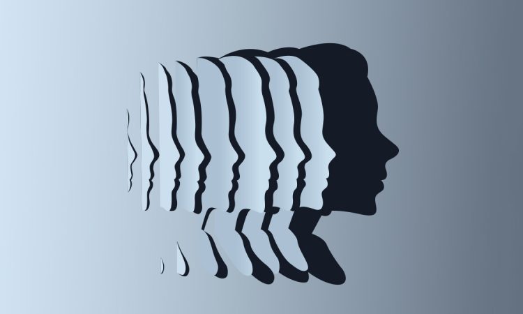 Series of overlapping faces cut out of paper