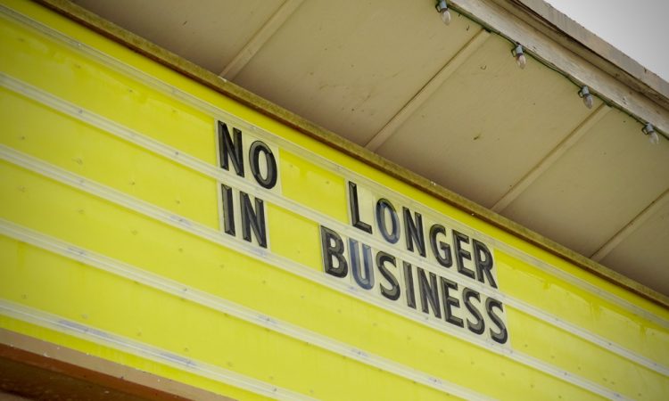 Store sign that reads "No longer in business"