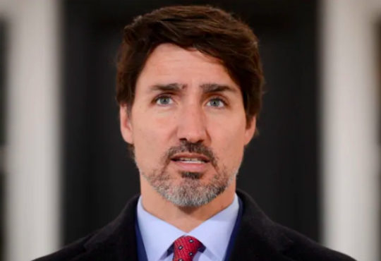 Justin Trudeau giving press conference.