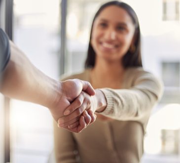 Woman shaking hands with other person