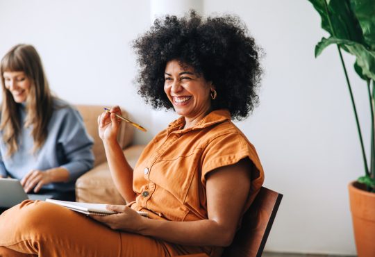 Woman smiling during meeting in office