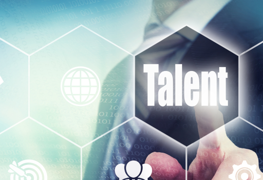 Person in suit pointing to graphic design with the word "talent"