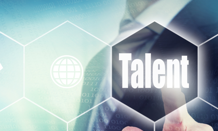 Person in suit pointing to graphic design with the word "talent"