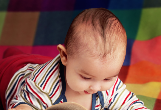 Baby reading novel