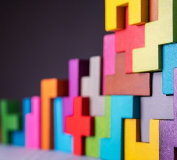 Geometric, colourful blocks connected in stack