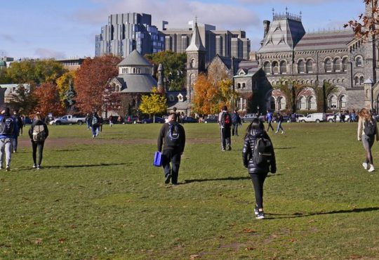 Students walk across the University of Toronto campus