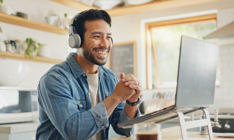 Man smiling during video call at home