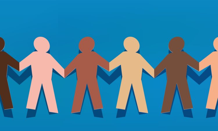 Paper chain of human cutouts of different skin tones holding hands.