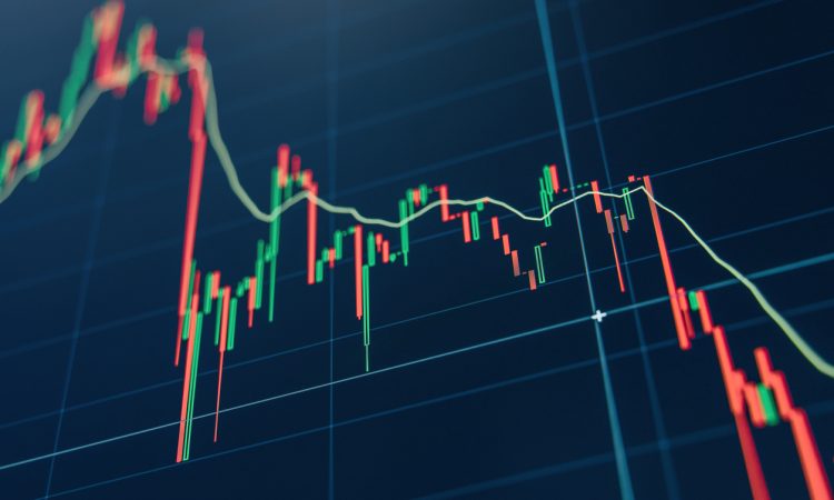 Crypto diagram with green and red candlesticks on blue display.