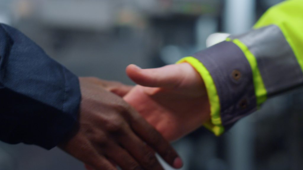 Closeup of two people shaking hands