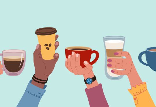 Diverse hands holding up cups of coffee