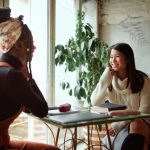 Two women talking in cafe