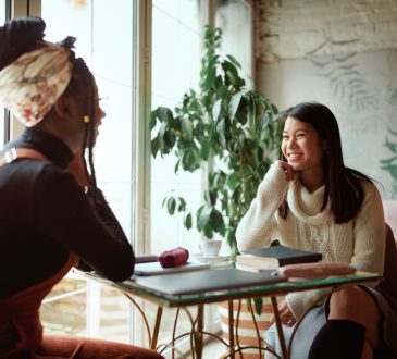 Two women talking in cafe