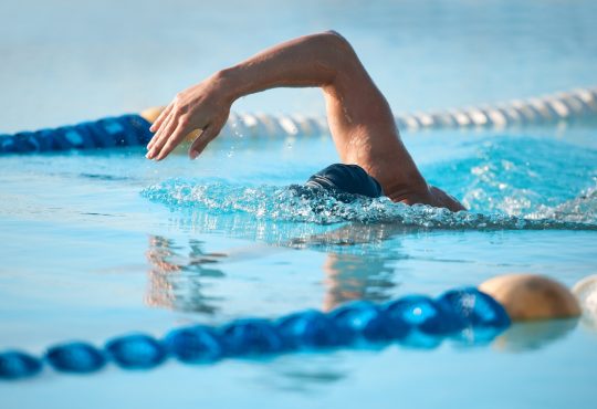 Swimmer doing laps in pool