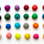 Colourful clay balls lined up in a grid