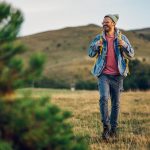 Man smiling while walking in nature