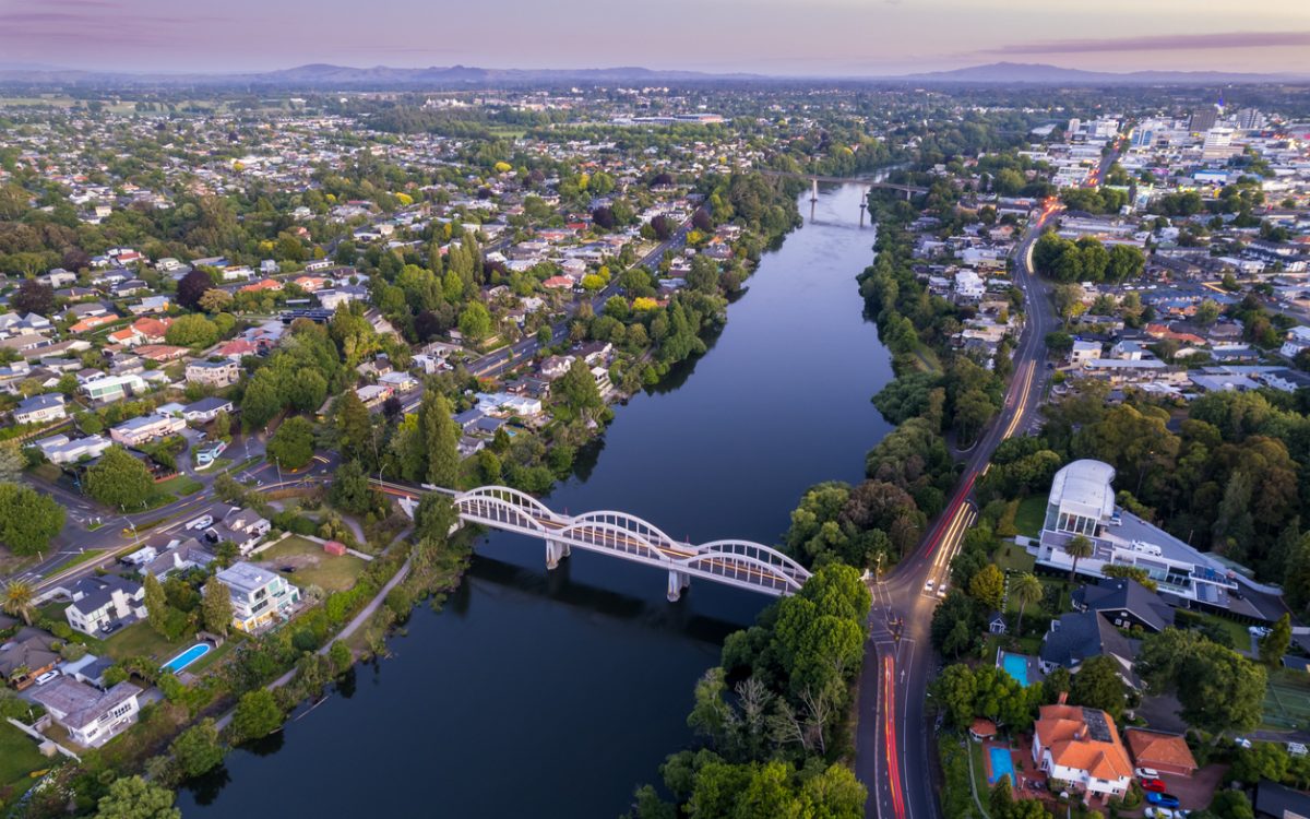 A drone captured view looking towards the central business district (CBD) from the Fairfield Bridge over the Waikato River as it cuts through the city of Hamilton, in Waikato, New Zealand.