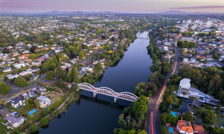 A drone captured view looking towards the central business district (CBD) from the Fairfield Bridge over the Waikato River as it cuts through the city of Hamilton, in Waikato, New Zealand.