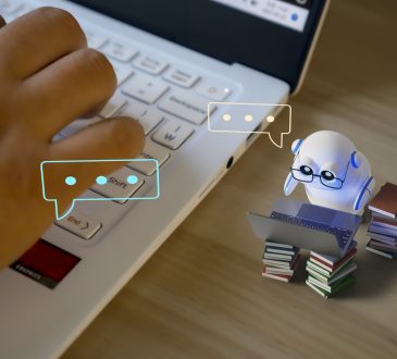 Photo illustration with tiny robot working on tiny computer alongside closeup of human hand on keyboard