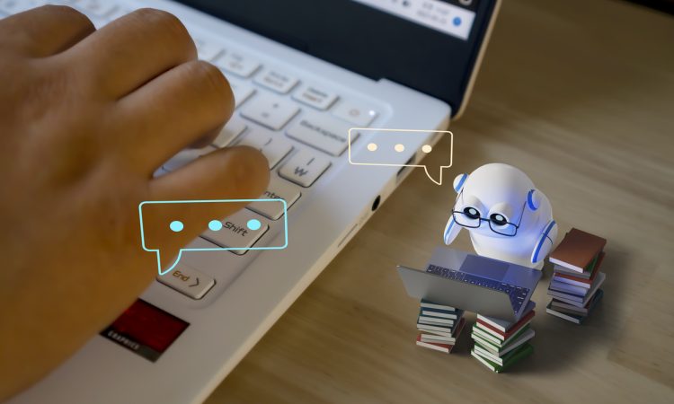 Photo illustration with tiny robot working on tiny computer alongside closeup of human hand on keyboard