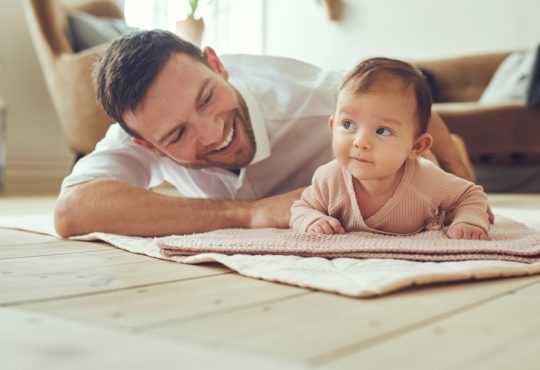 Dad with baby at home