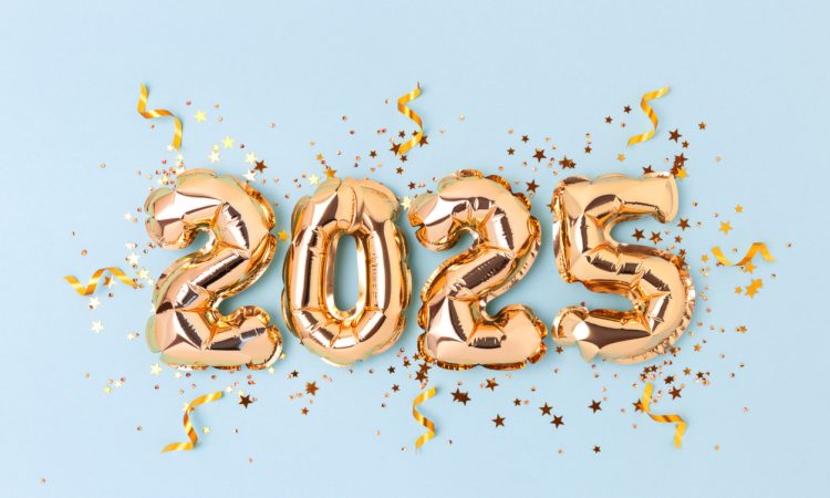 Golden inflatable balloons spelling out 2025