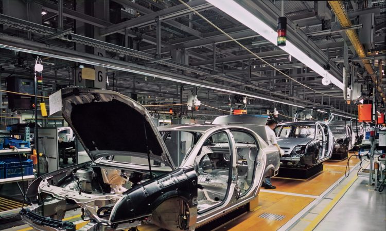 car production line with unfinished cars in a row