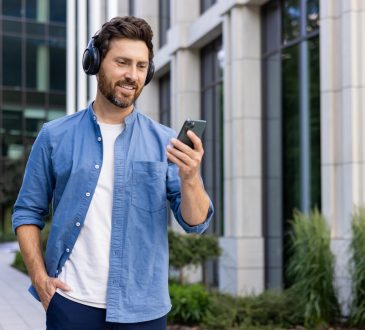 Man walking outside while wearing headphones