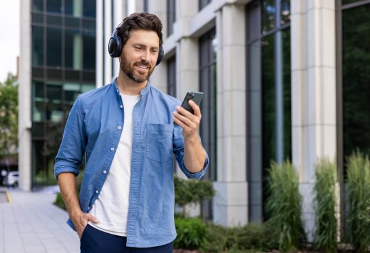 Man walking outside while wearing headphones