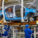 Car on assembly line in factory