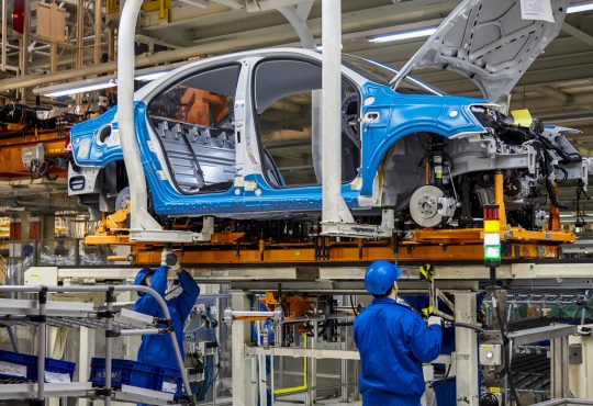 Car on assembly line in factory