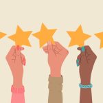Group of hands holding a five stars rating.