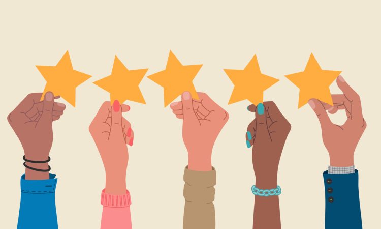 Group of hands holding a five stars rating.