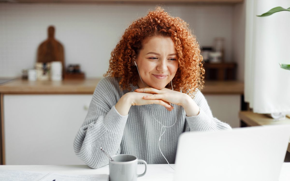Woman watching video on laptop