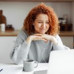 Woman watching video on laptop