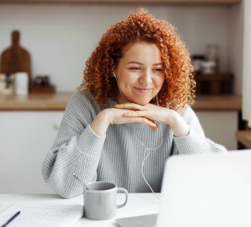 Woman watching video on laptop