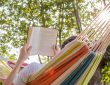 Person reading in hammock