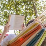 Person reading in hammock