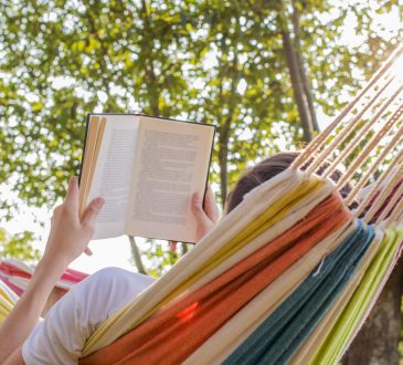 Person reading in hammock