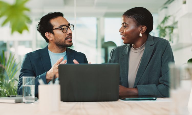 Man and woman talking in office