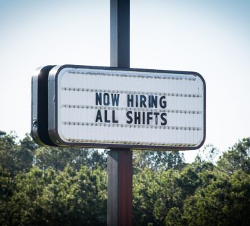 Business sign advertising job opportunities