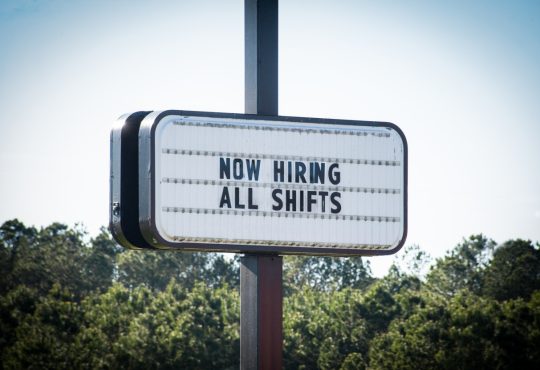 Business sign advertising job opportunities