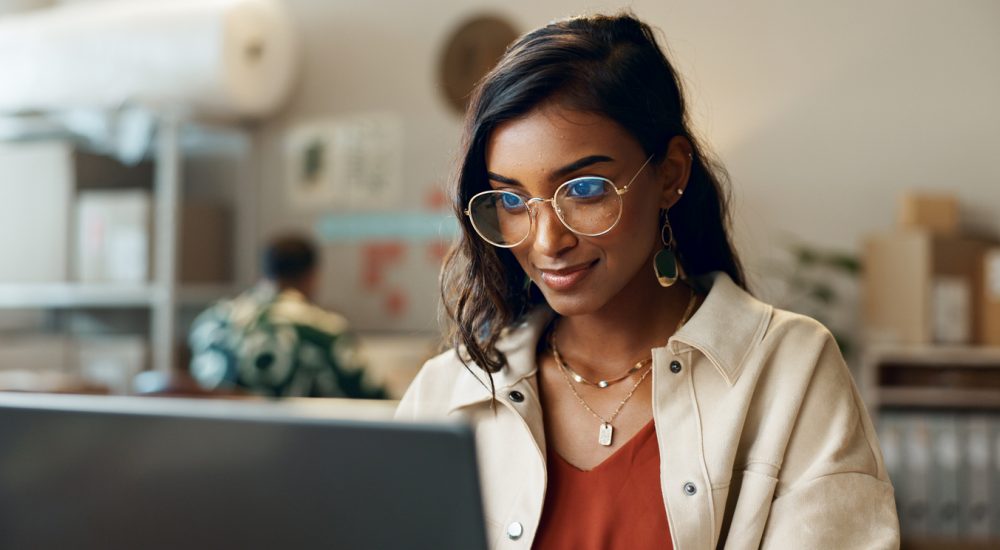 Woman reading on laptop
