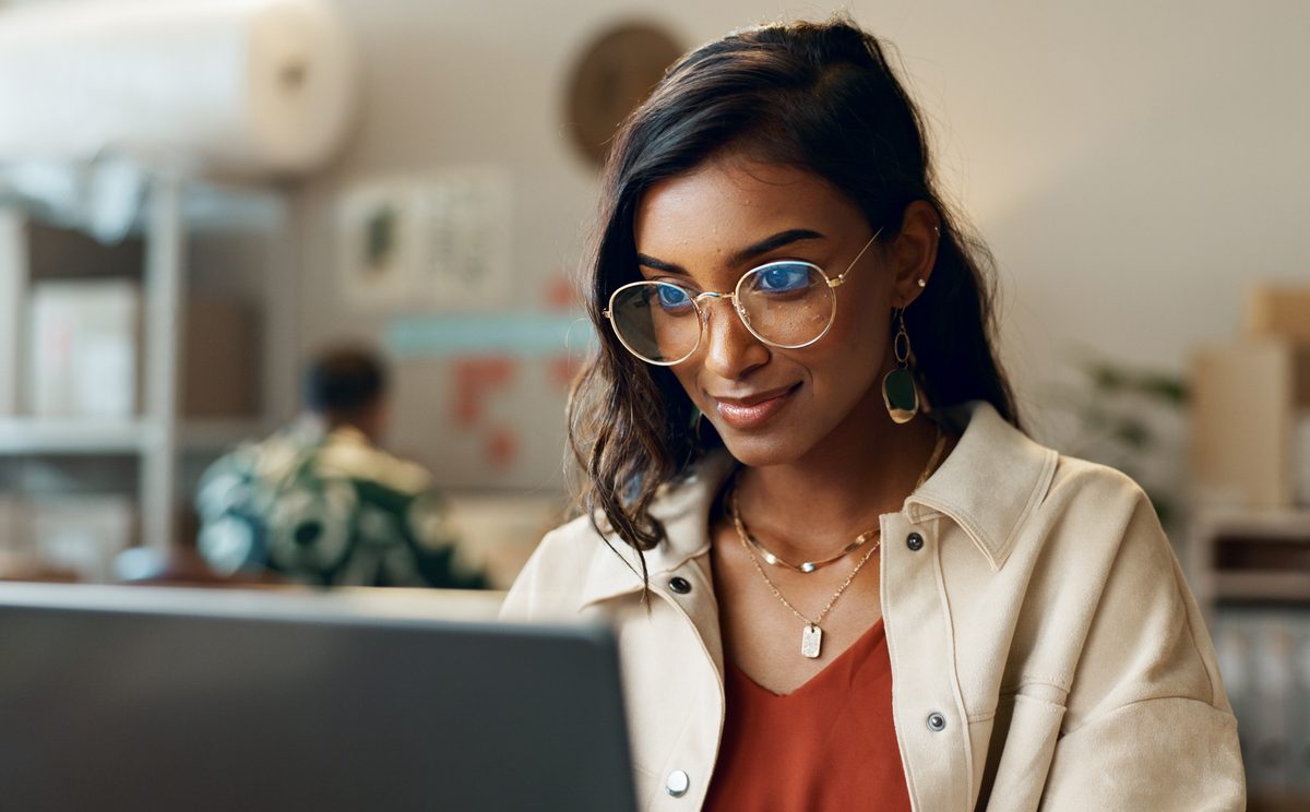 Woman reading on laptop