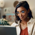 Woman reading on laptop