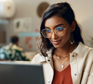 Woman reading on laptop